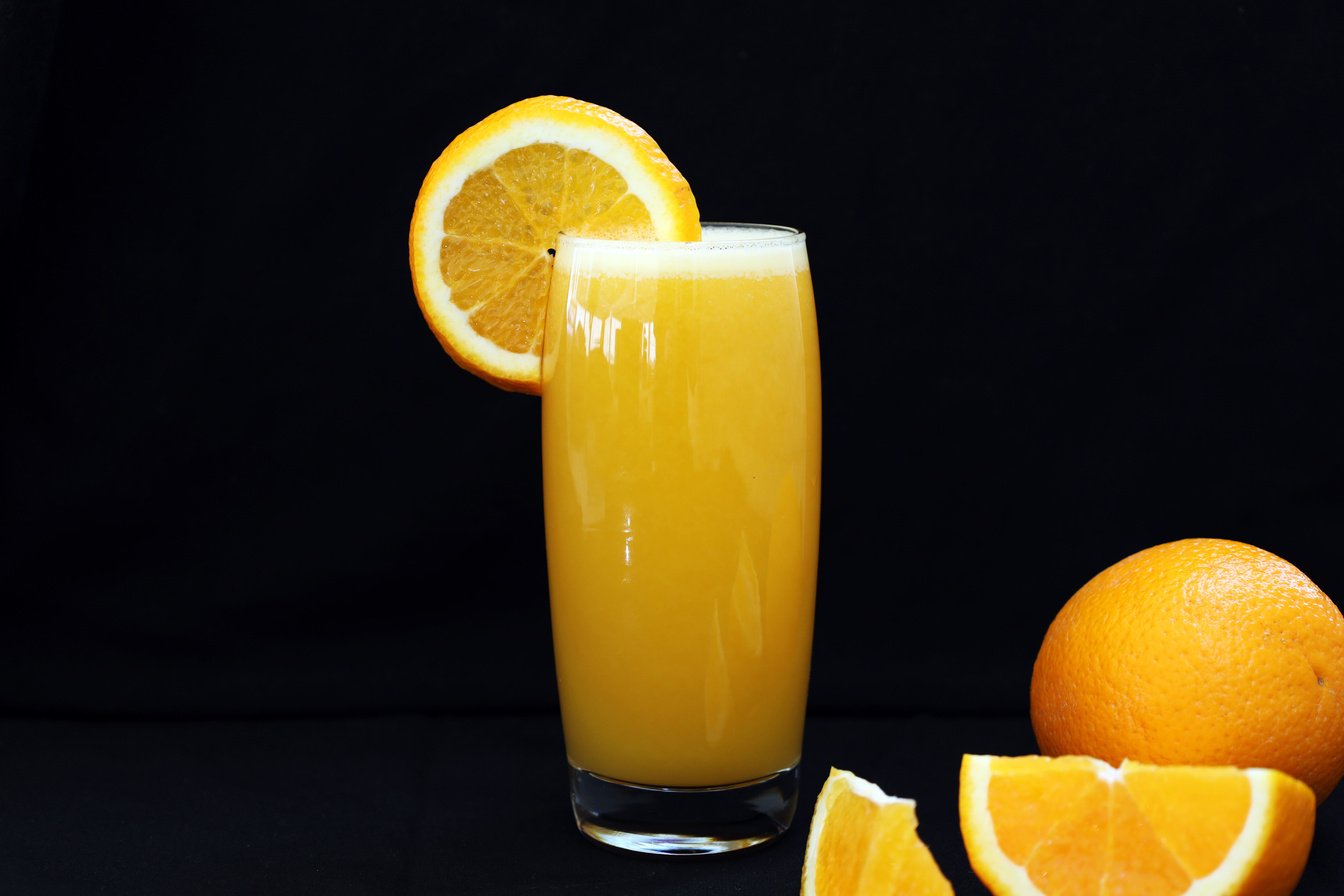 Orange Fruit Juice in Clear Drinking Glass